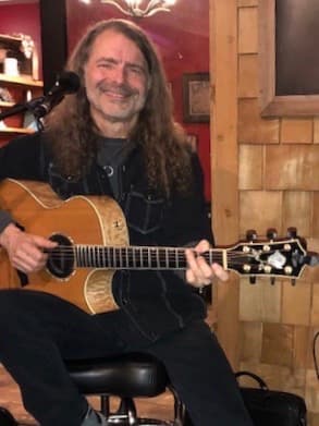 Ron Wright playing acoustic guitar